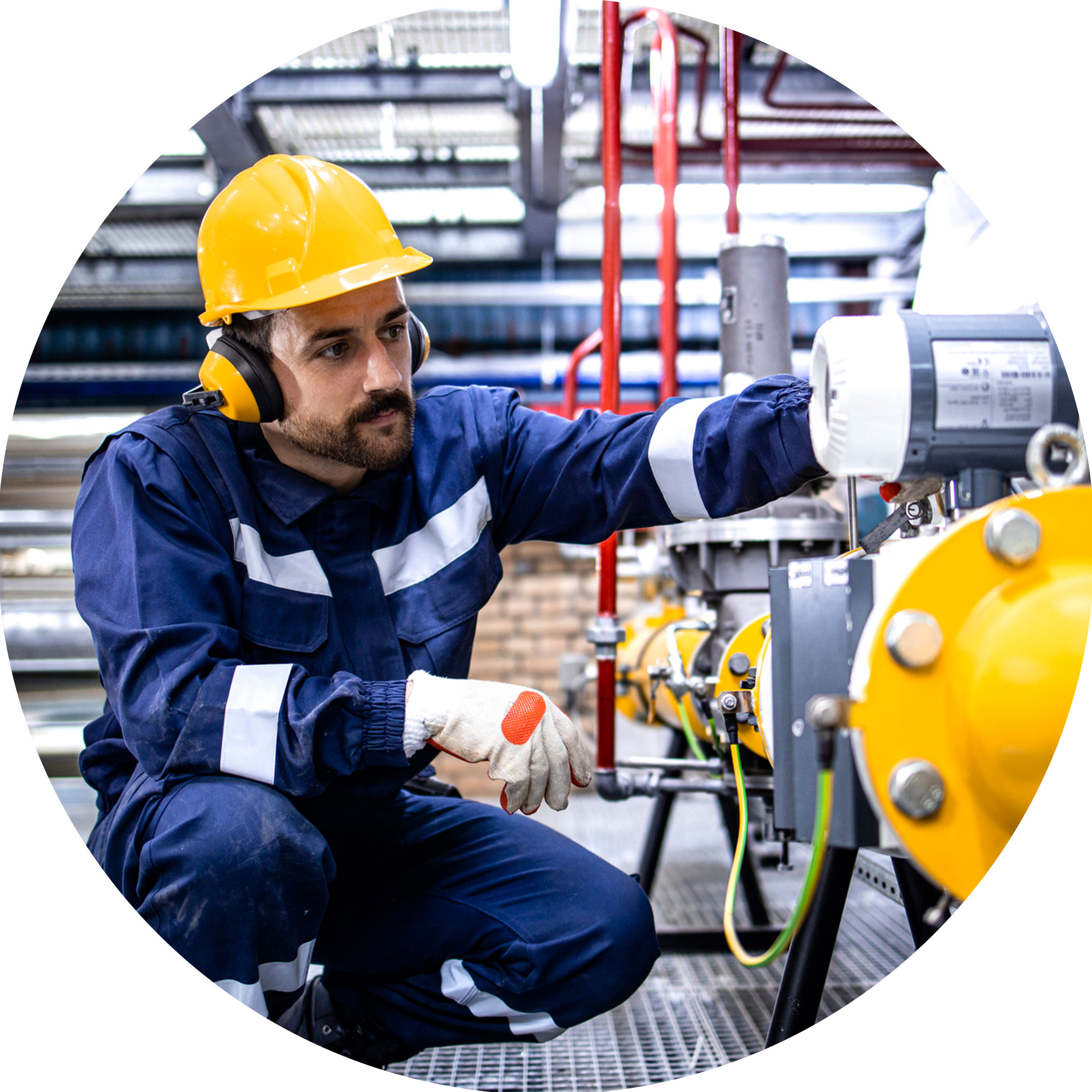 man inspecting machinery