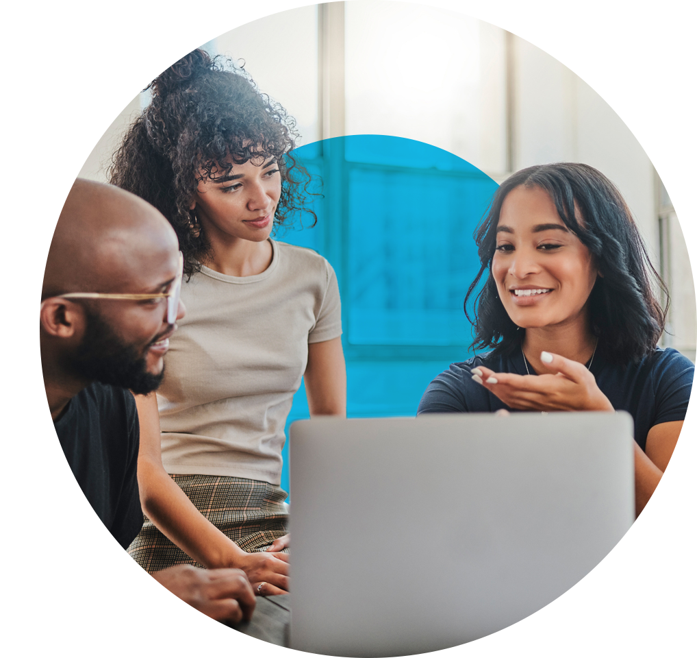 three people looking at a laptop